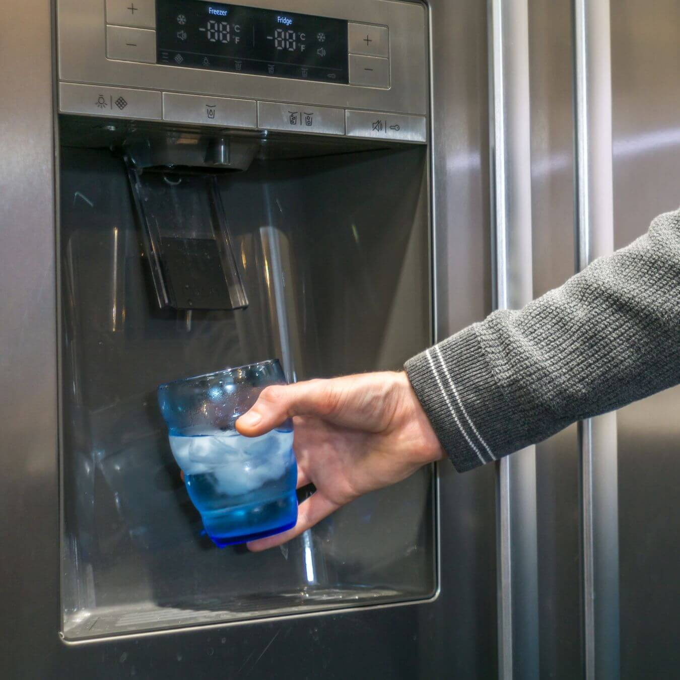 Getting water from a refrigerator water dispenser