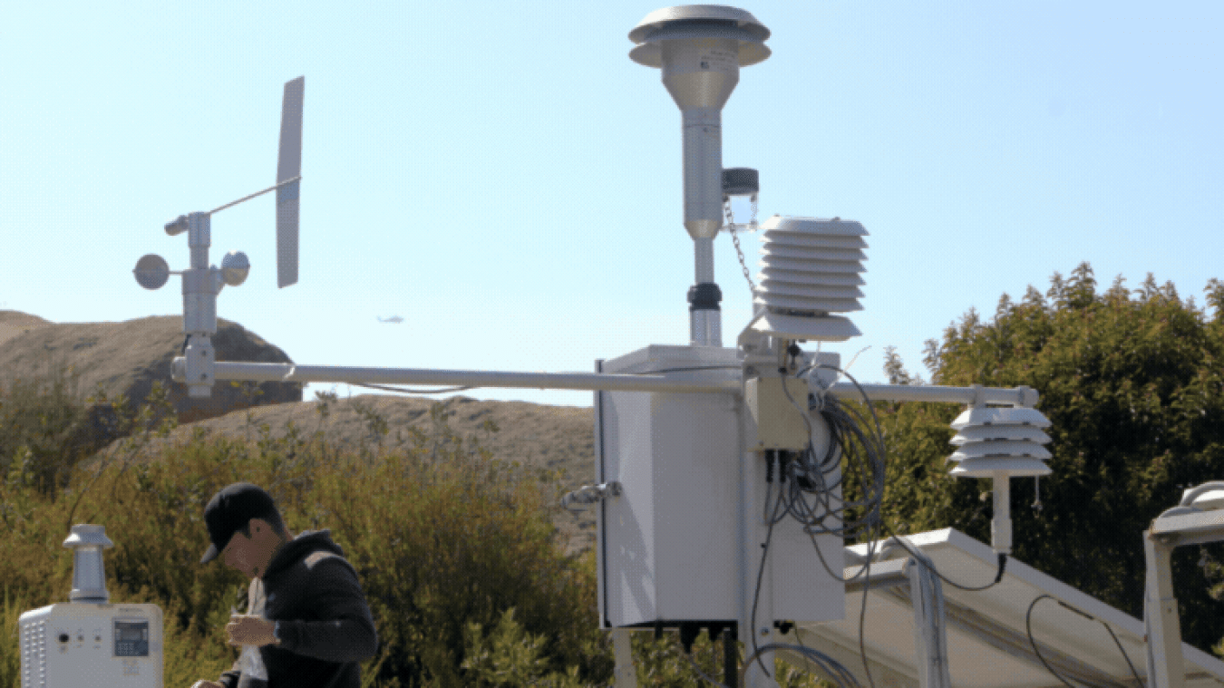 Rotating set of images of air monitoring devices placed around the ETEC Site