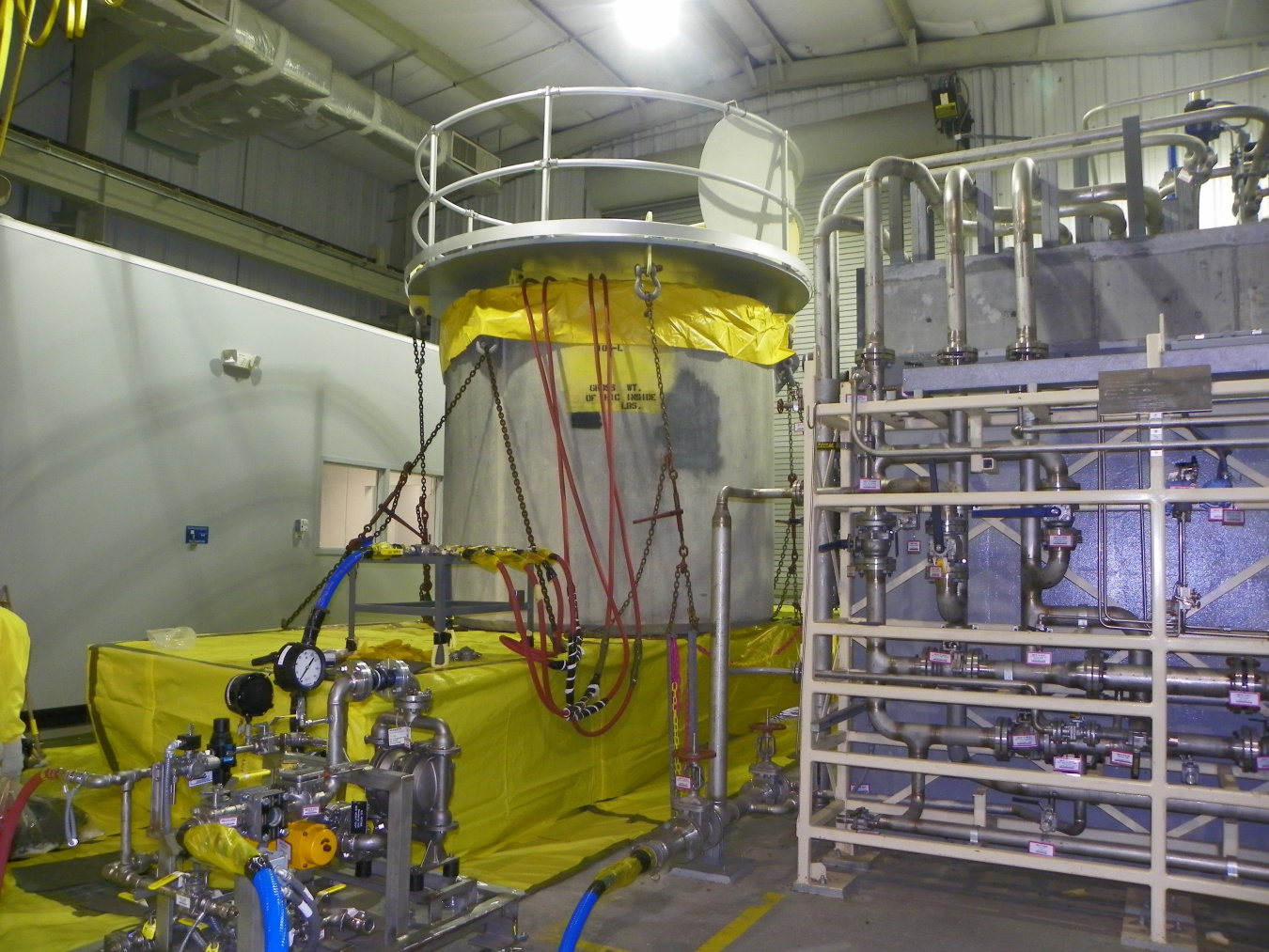 A yellow machine with pipes around it at the Savannah River Site