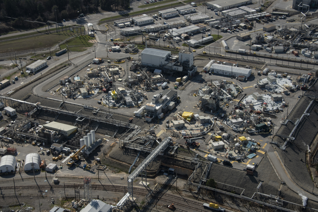 Aerial view of the large F and H Tank Farms at the Savannah River Site with lots of facility buildings and roads surrounding