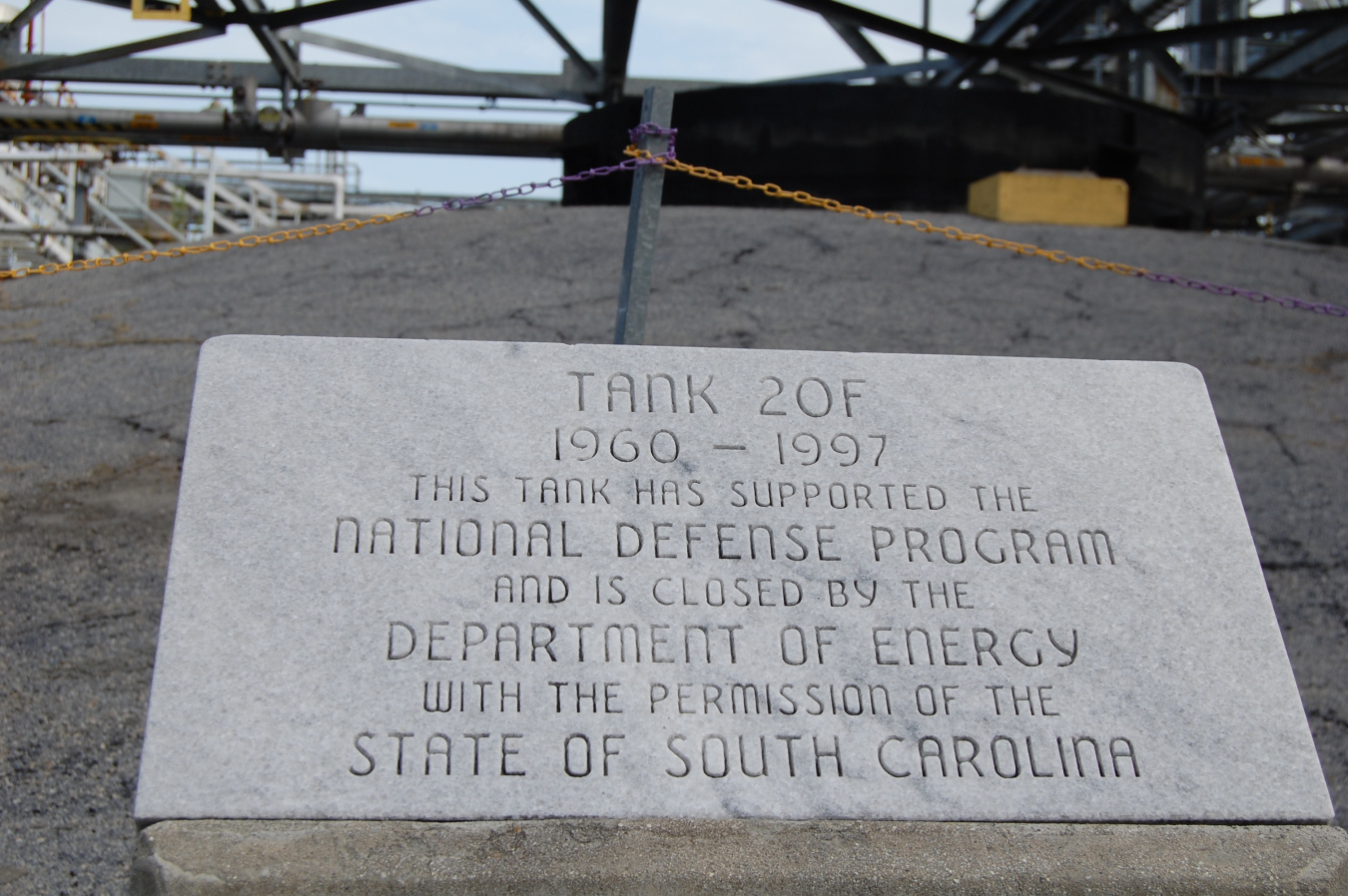 Savannah River Site concrete marker that reads: "Tank 20F, 1960-1977, This Tank has Supported the National Defense Program and is Closed by the Department of Energy with Permission of the State of South Carolina.