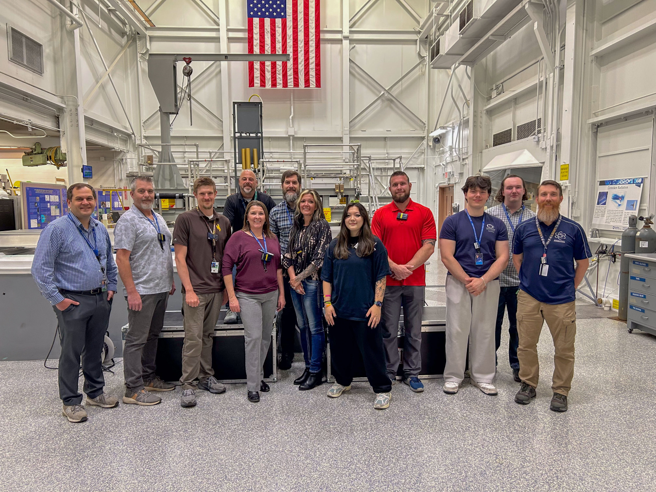 A group photo of scientists and students in a laboratory 