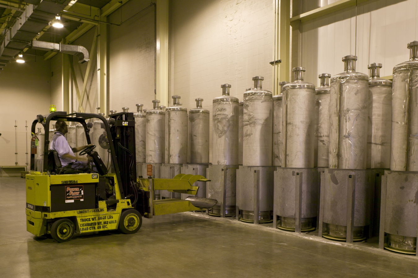 Employee at the savannah river site operating a fork lift in a facility building