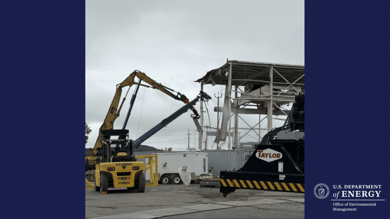 Rotating set of images of construction vehicles demolishing a building at the West Valley Site.