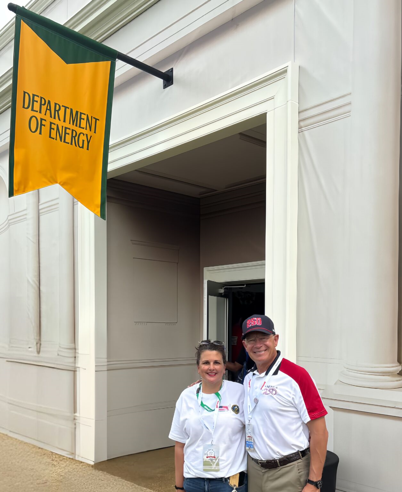 Two people in front of DOE booth