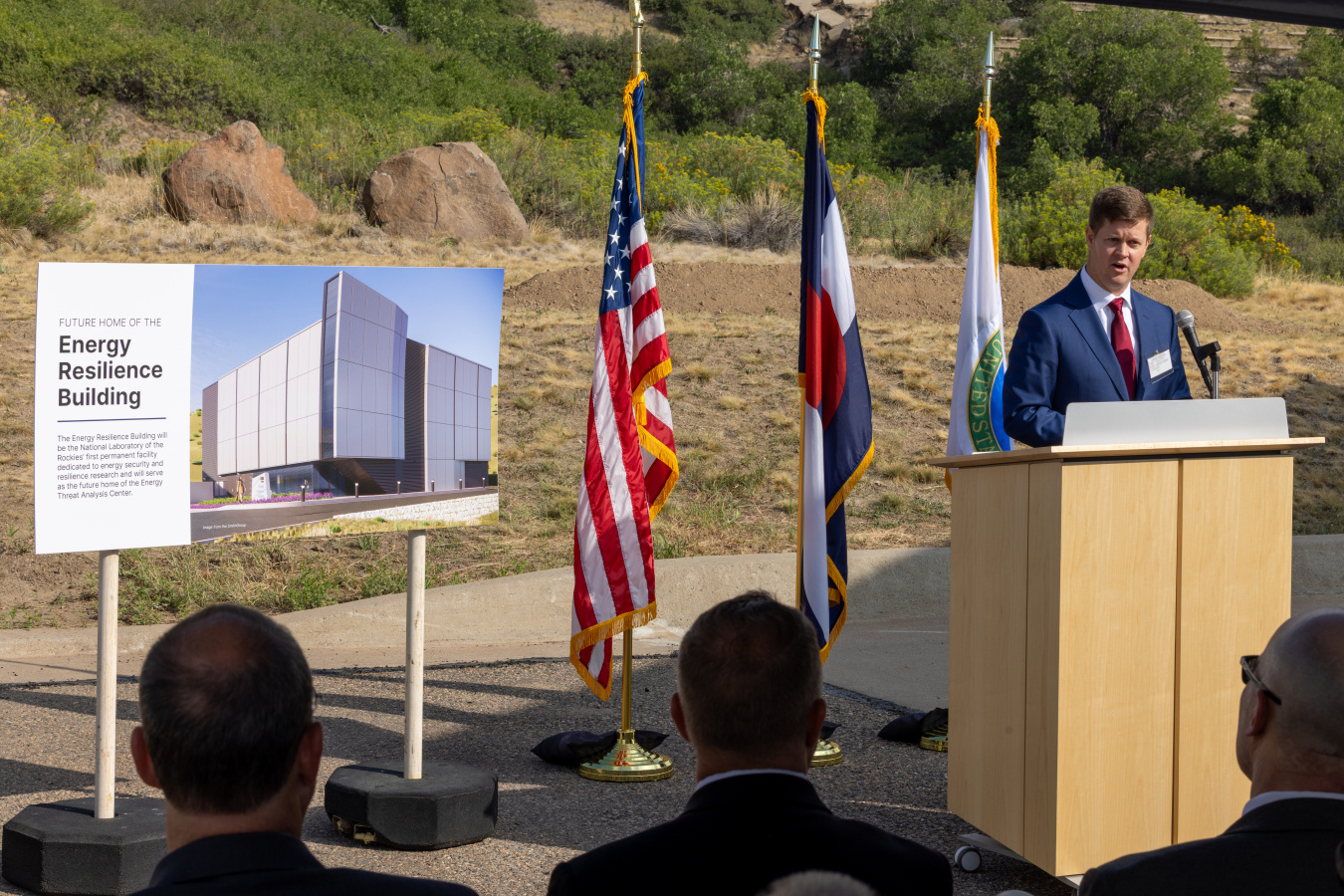 CESER Director Andrew McClure speaking from a podium at the Energy Resilience Building construction site.