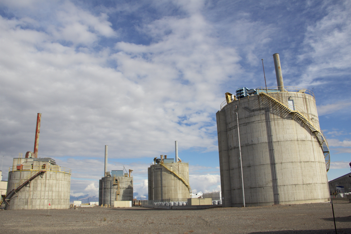 Four large concrete waste vaults outside at the Idaho site