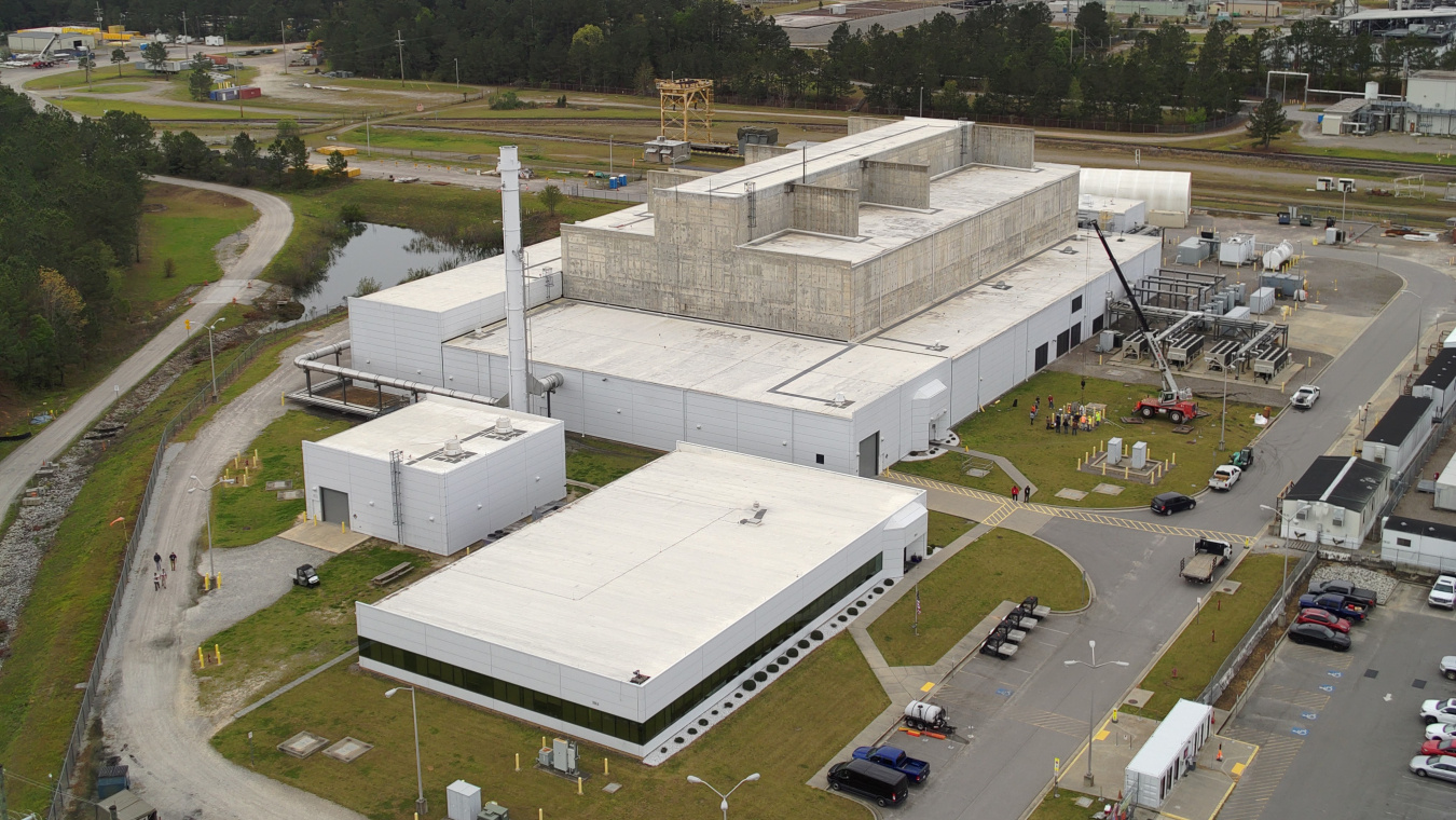 Aerial view of a large white facility building at the Savannah River Site
