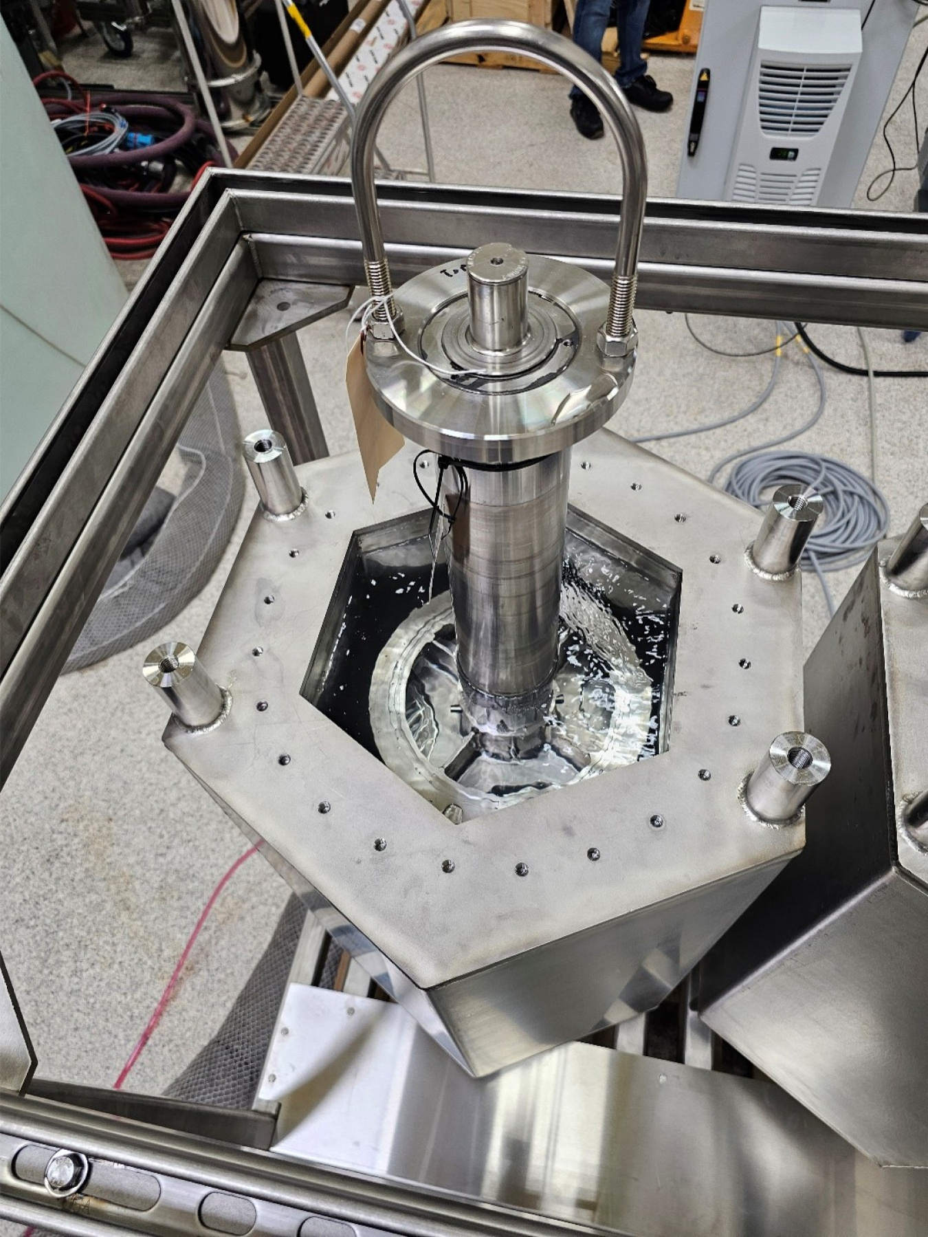 A metal ultrasonic cleaning machine inside a laboratory