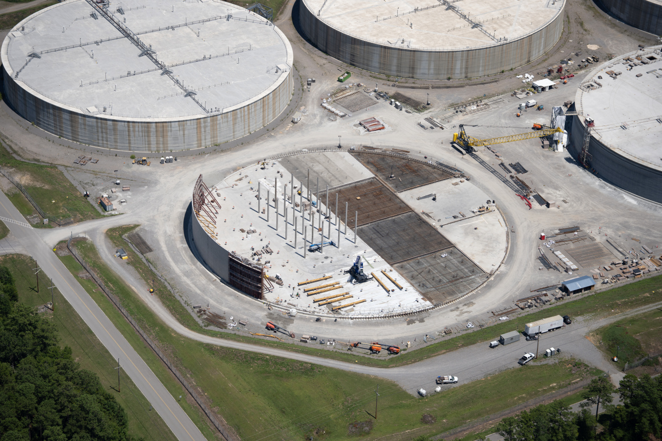 Aerial view of four large circular disposal unit buildings at the Savannah River Site
