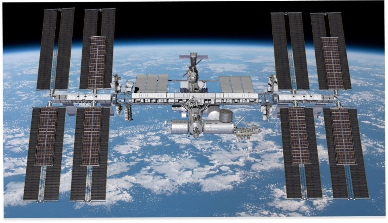 International Space Station in low Earth orbit, with its solar arrays fully deployed. The multinational orbital laboratory has been continuously occupied since 2000, serving as a hub for scientific research and international cooperation in space.
