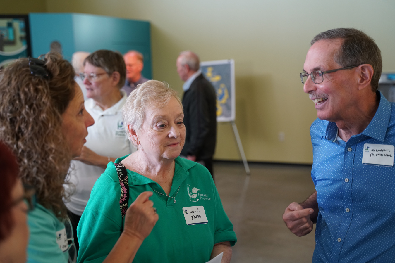 FRESH President Lisa Crawford (center) and FCA President Graham Mitchell (right) chat with attendees at the Fernald Preserve 20th Anniversary Event.