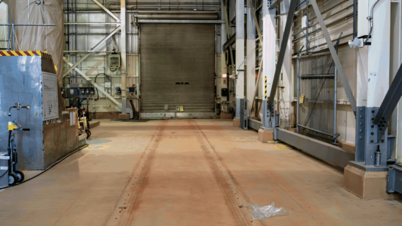 A rotating set of images of before and after recovery of a rail system inside a facility building