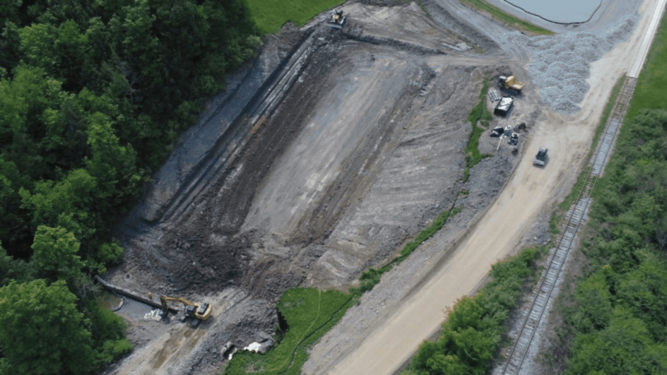 Rotating set of images of a spillway being rebuilt at the West Valley Demonstration Project