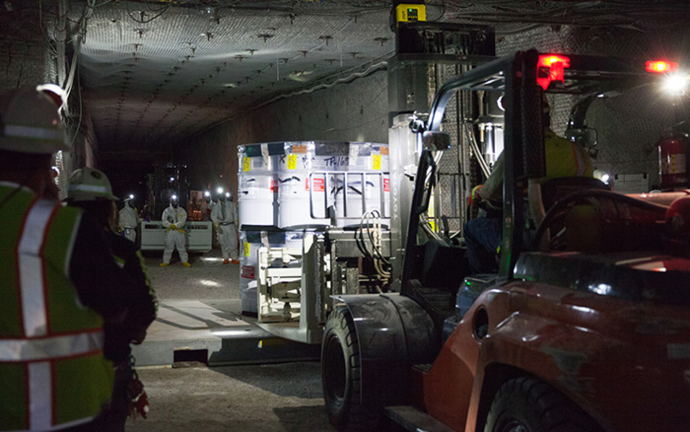 700 UG Waste emplacement 01- Nuclear Waste Partnership workers emplace waste in the WIPP underground.jpg