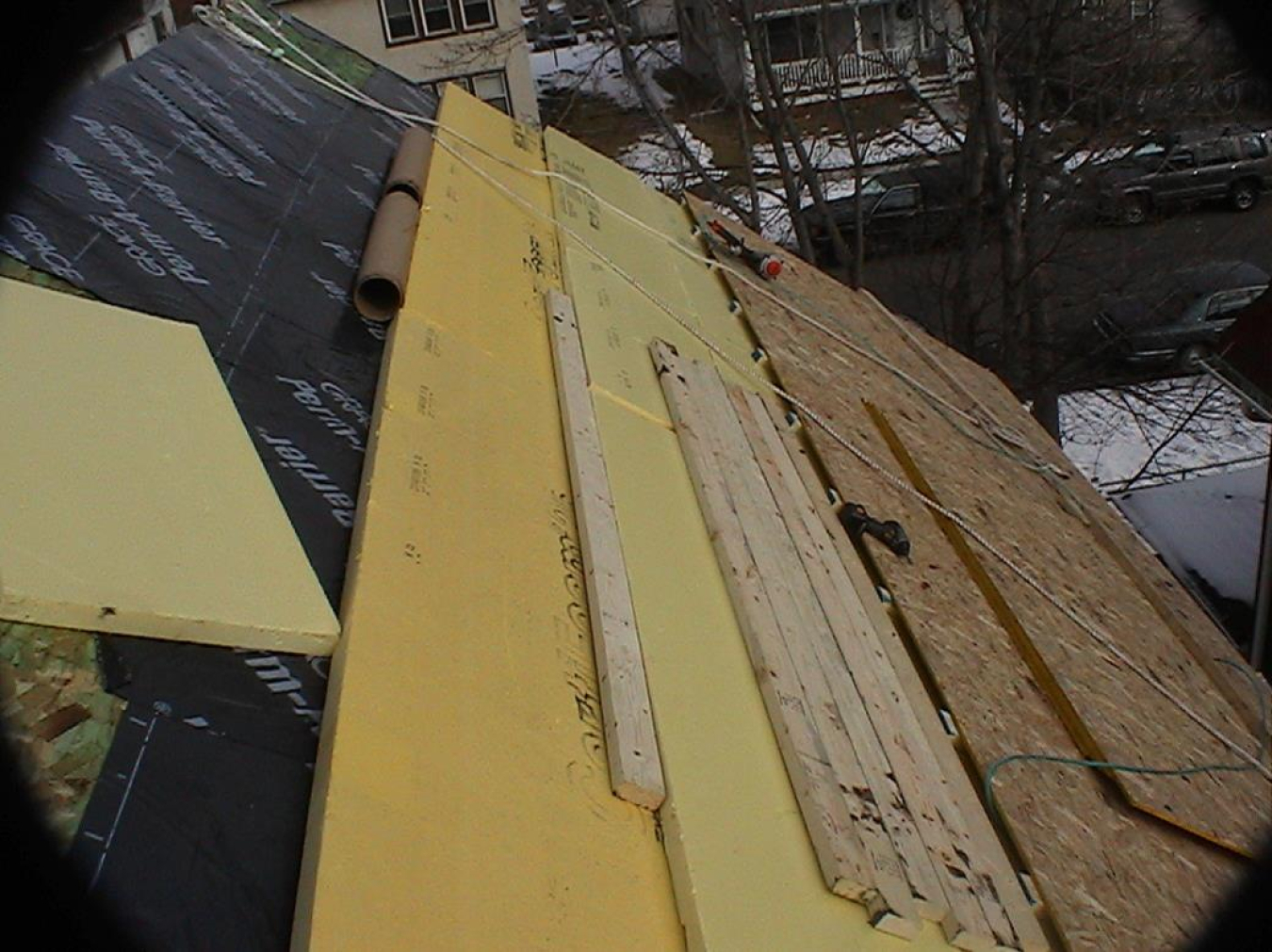 Photo of a rigid exterior insulation installed on the roof of a house.