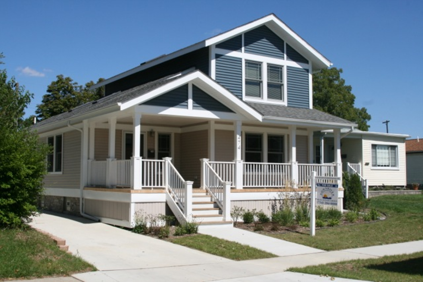 A two-story house with a porch across the front.