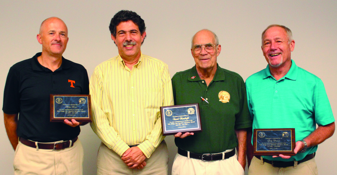 Mike Ford, Dave Hemelright, and Greg Paulus receive plaques for service.