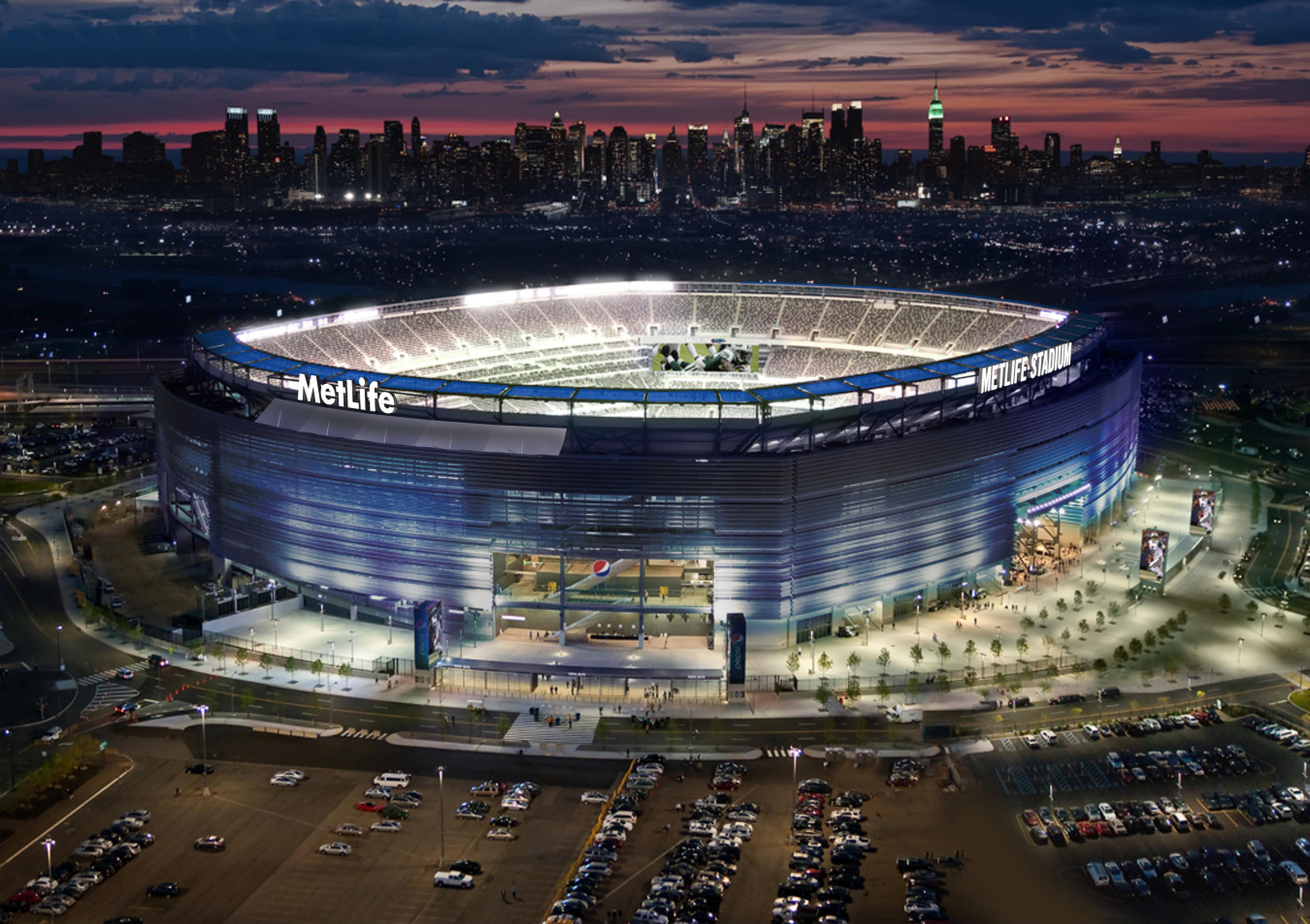 Photo of MetLife Field at night with the lights shining.