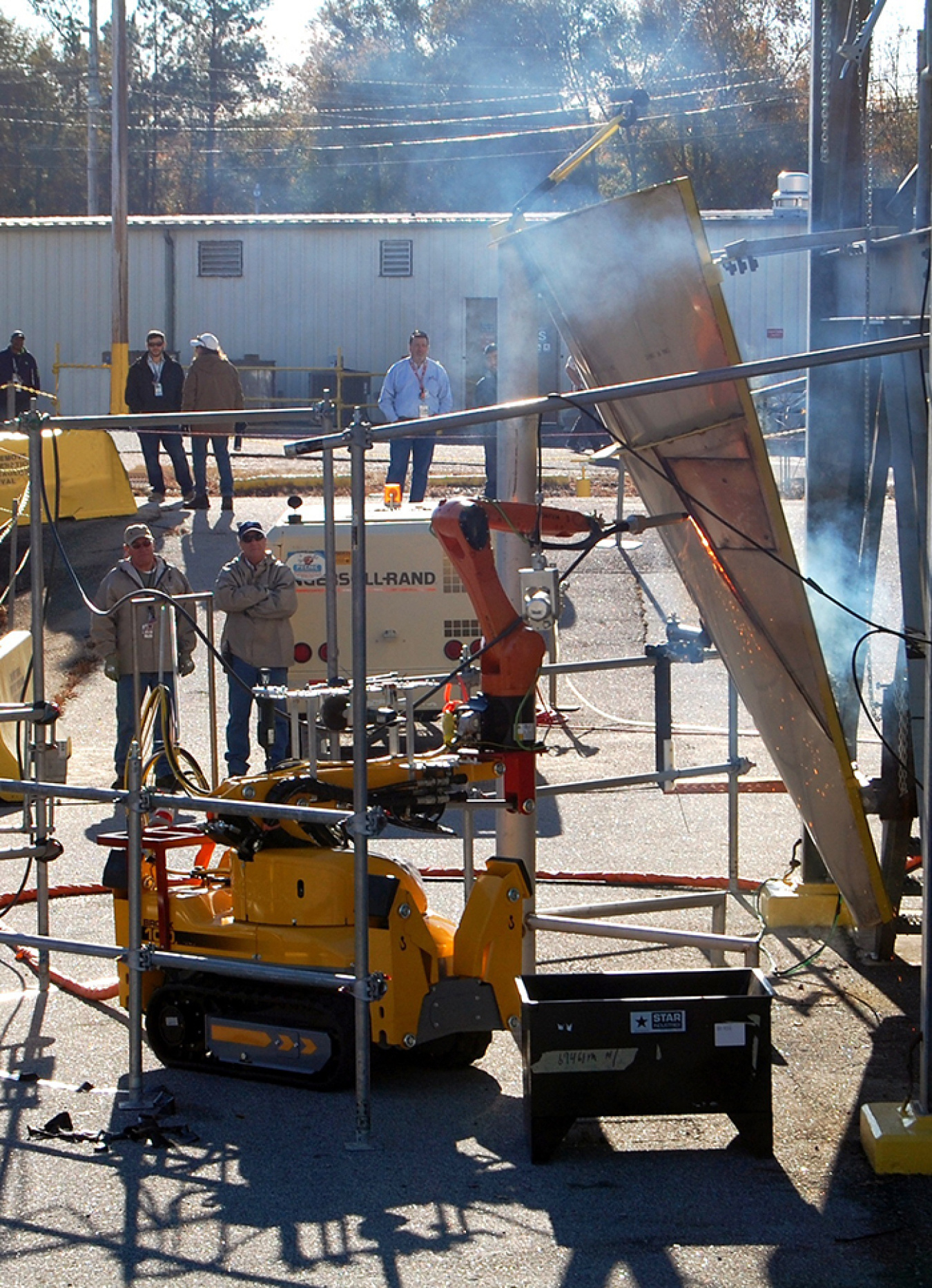 Photo 1 700 - Brokk cutting mock up shaped like the evaporator vessel cone..jpg