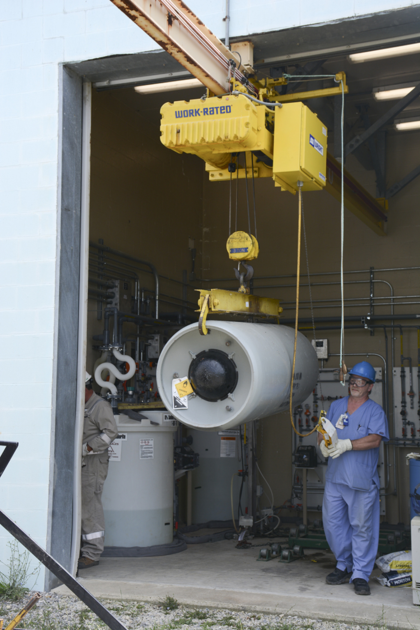 Workers removed the two 2,000-pound containers of liquid chlorine at the X-611 Water Treatment Facility at the Portsmouth Gaseous Diffusion Plant.