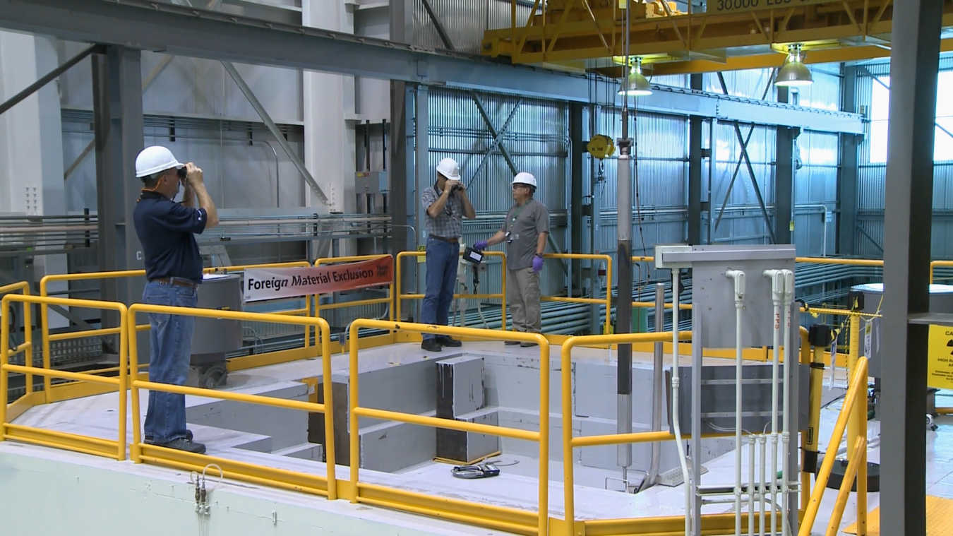 Idaho National Laboratory scientists and engineers perform a fuel inspection at the TREAT reactor facility.