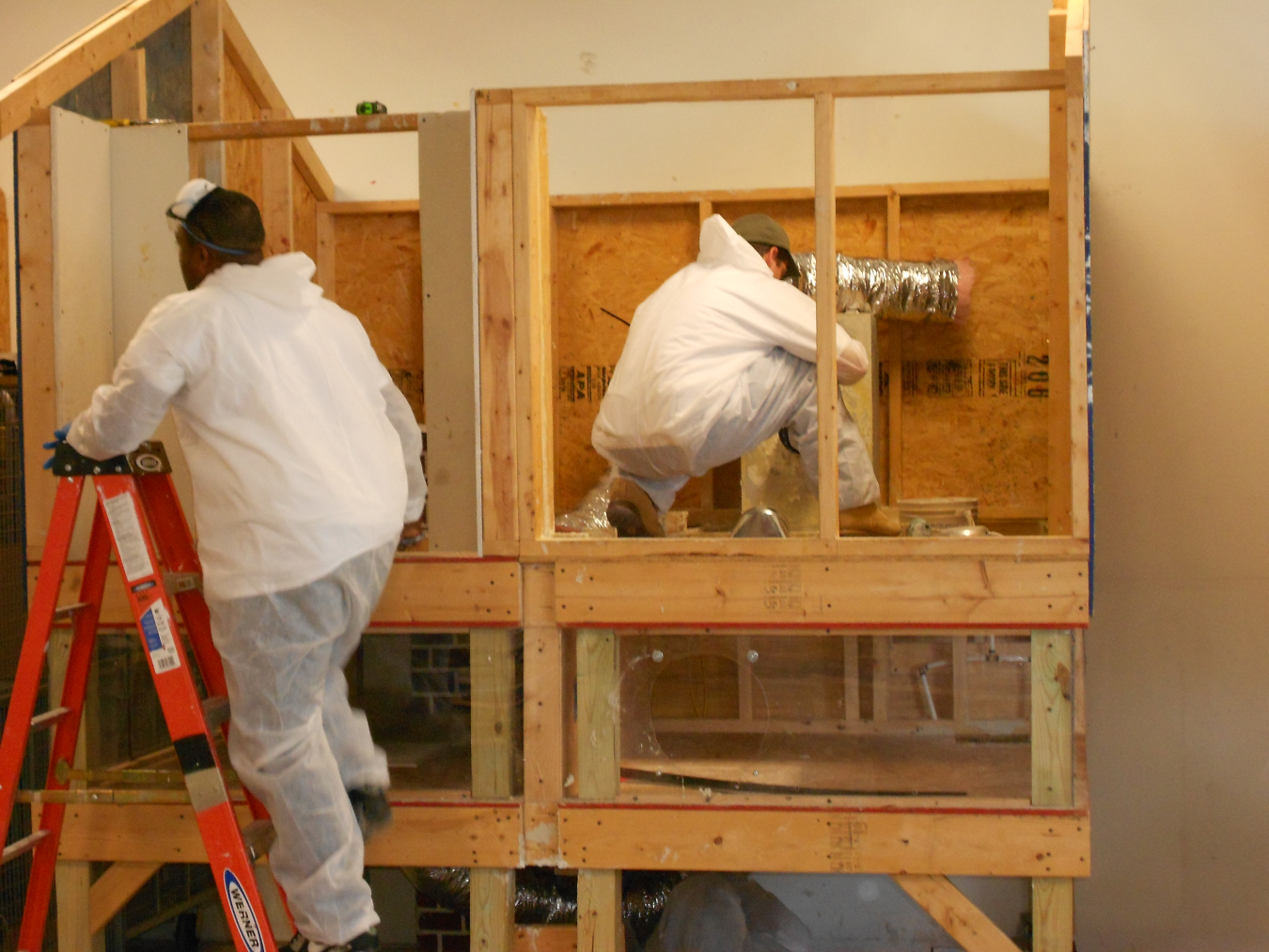 Trainees practice techniques on miniature model homes at the New River Center for Energy Research & Training in  Christiansburg, Virginia.