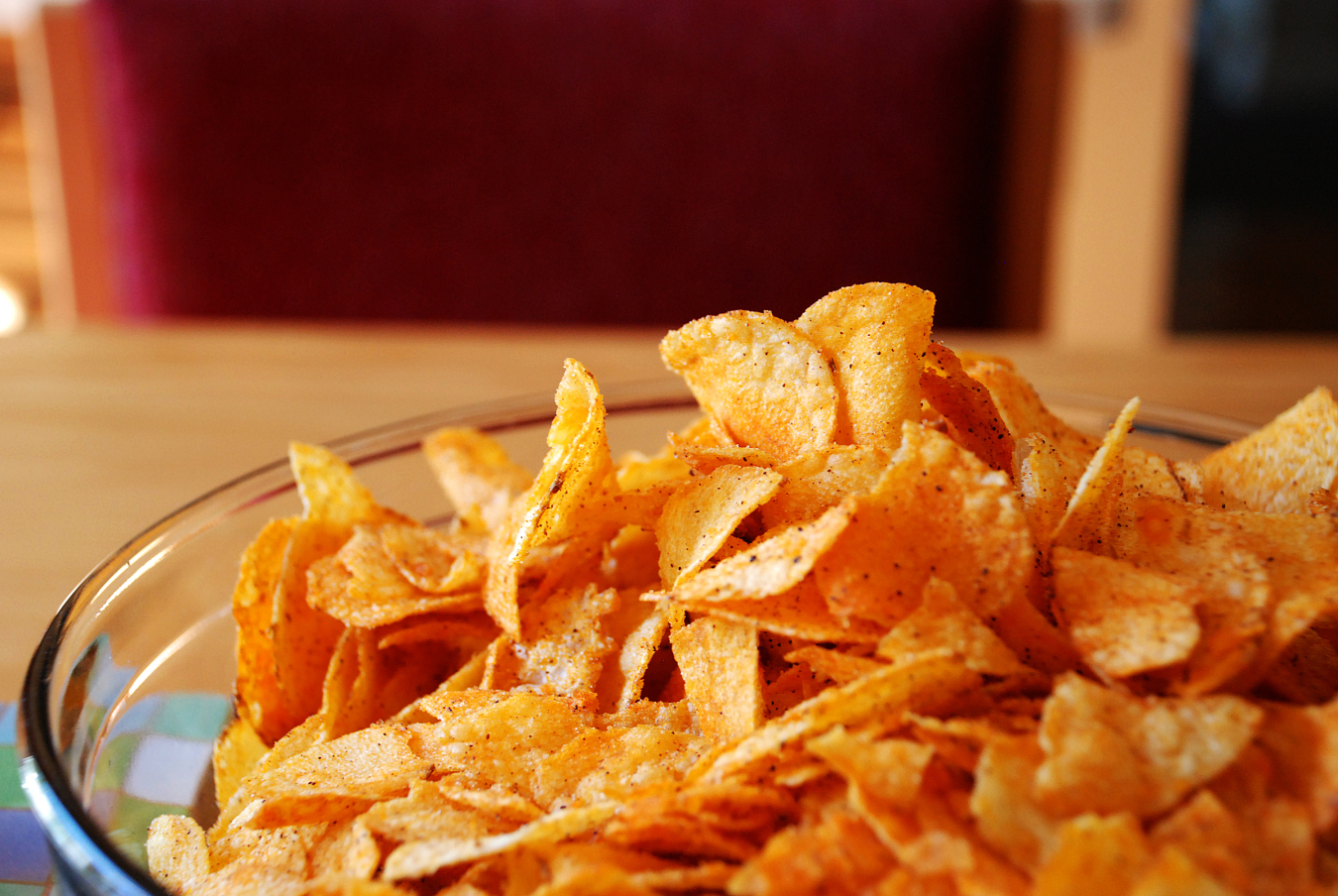 Photo of a bowl of barbecue potato chips. 