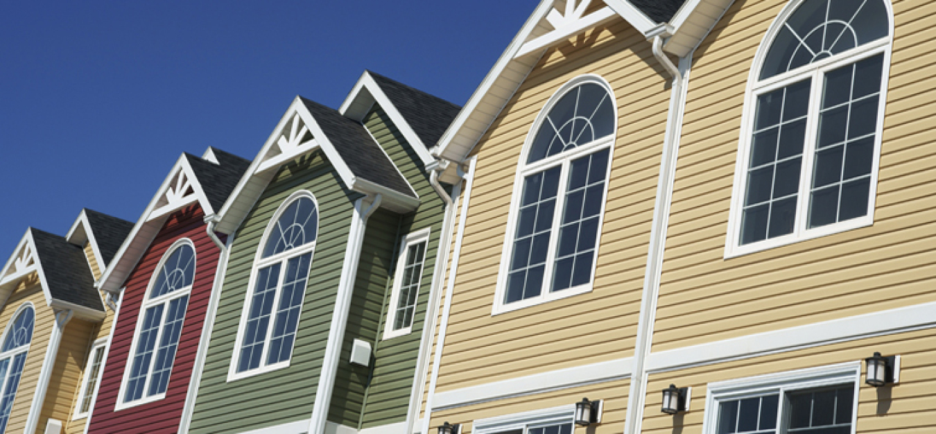 Photo of a row of residential townhouses or apartments.