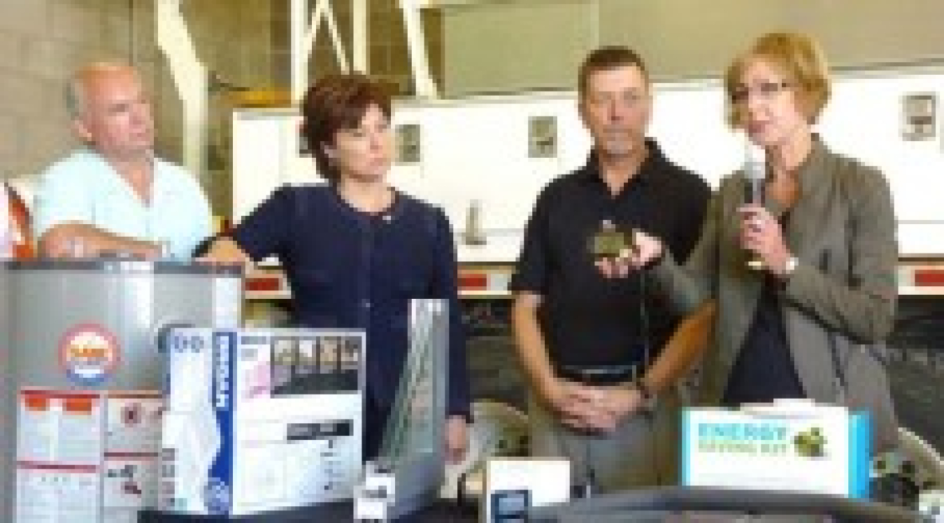 British Columbia Energy Minister Bill Bennett, British Columbia 35th Premier Christy Clark, and BC Hydro’s Gary Hamer and Joanna Sofield demonstrate the Energy-Saving Kit. 