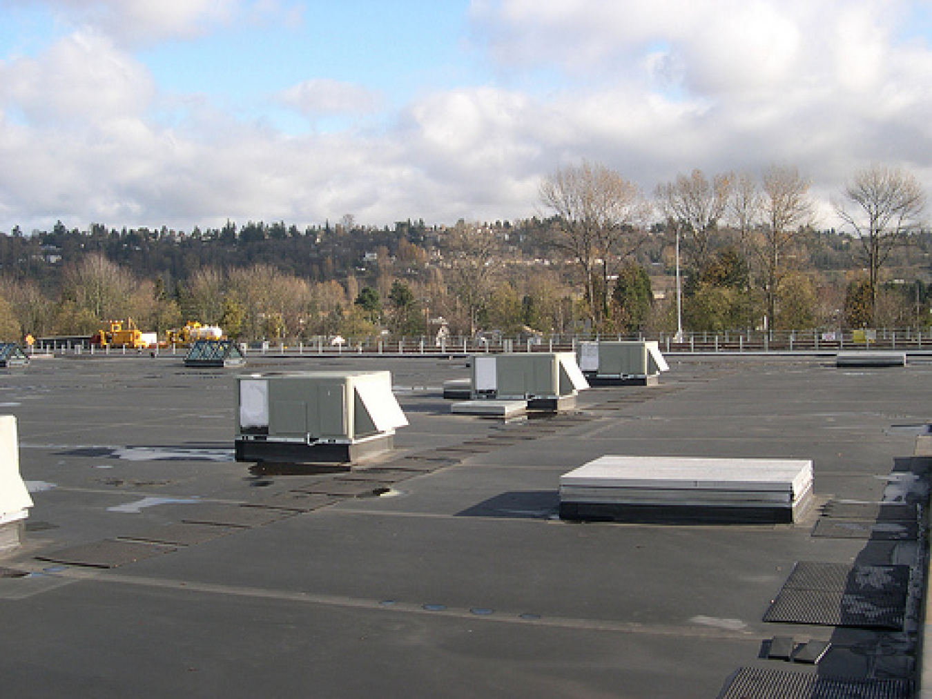 Rooftop of a commercial building with heating, ventilation, air conditioning and refrigeration units.