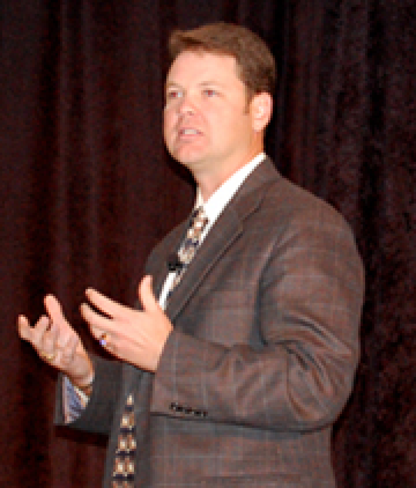 Photo of a man giving a presentation.