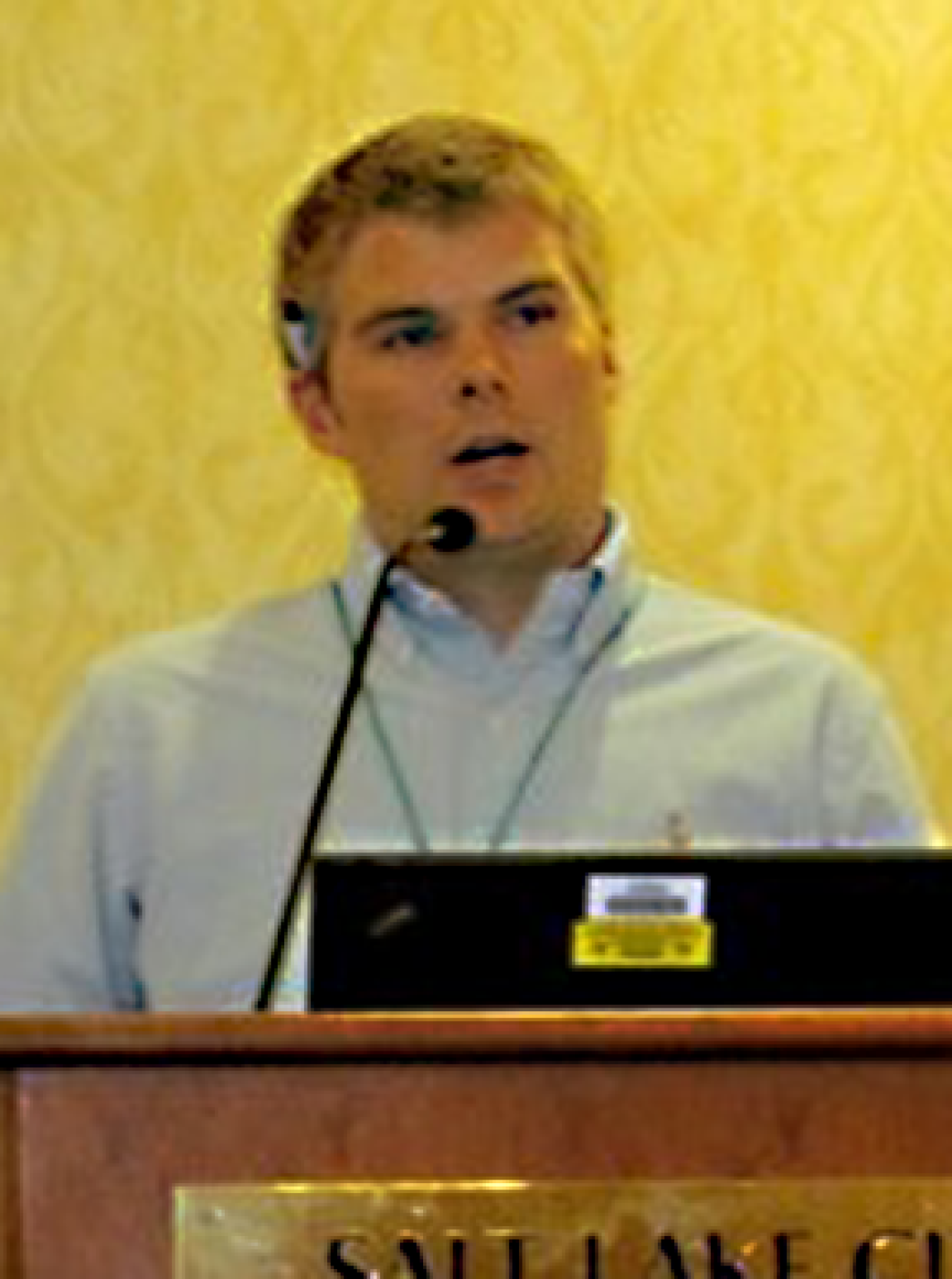 Jeremy Williams speaking at a lectern.