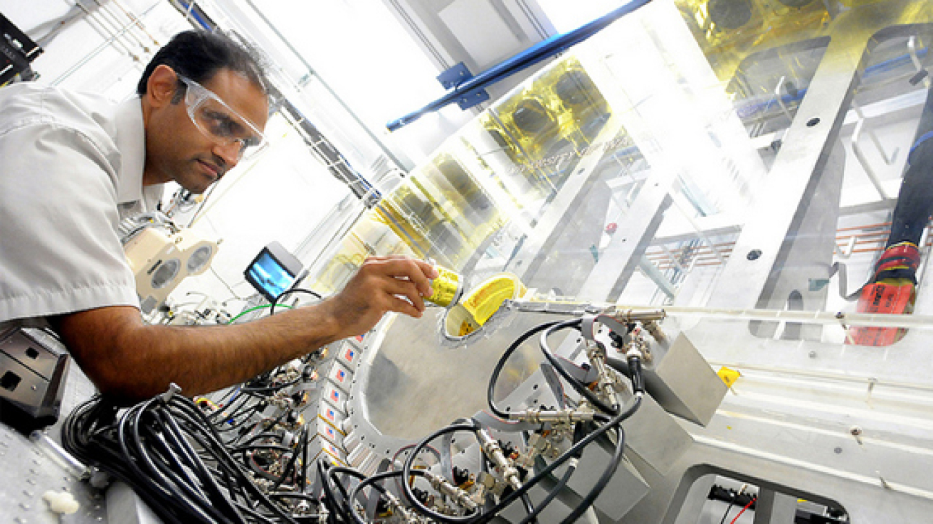 Argonne physicist Mahalingam Balasubramanian loads an in situ lithium-ion battery into the low-energy resolution inelastic X-ray (LERIX) system at the Advanced Photon Source.