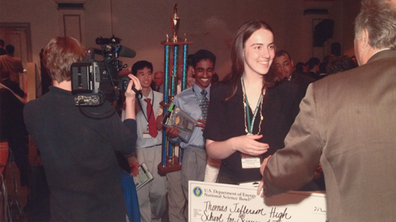 Kay Aull, 2003 National Science Bowl Champion holding the first place prize check.