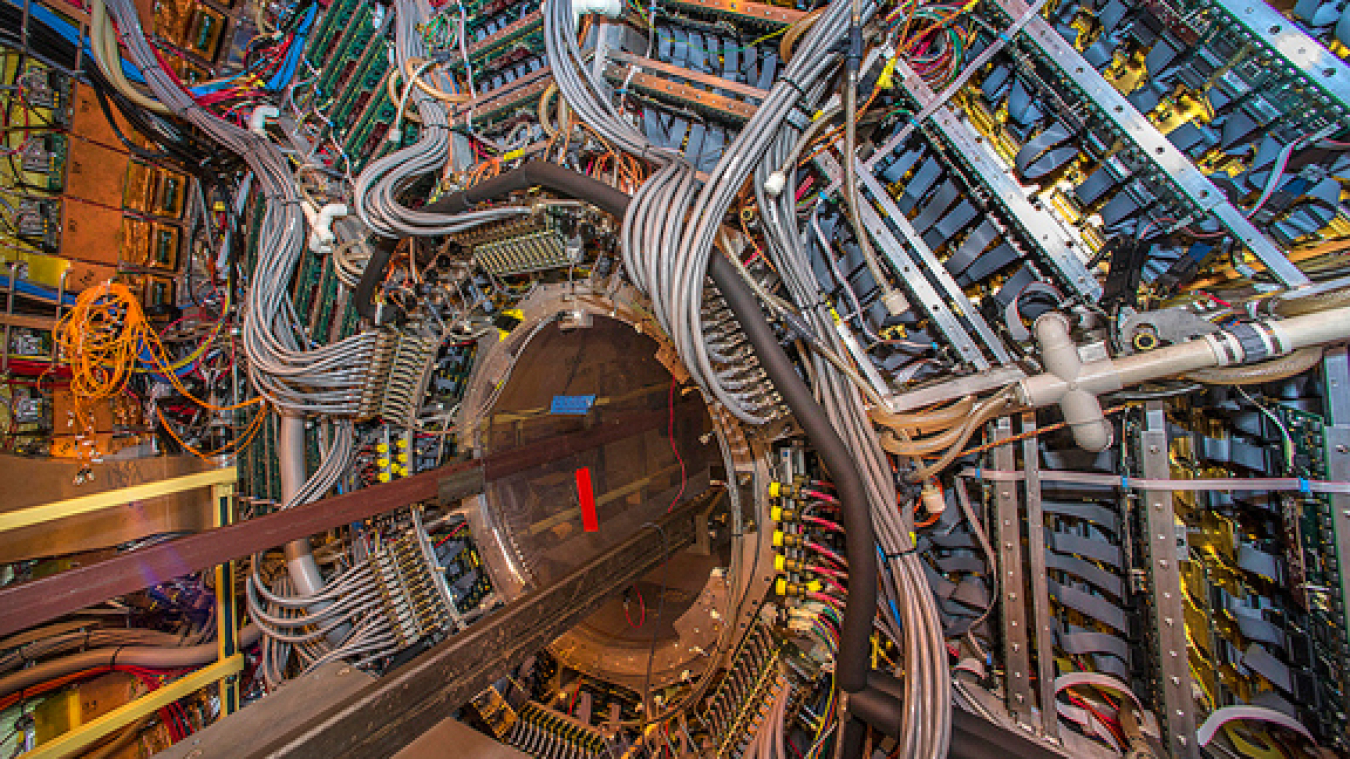 Detectors at the Relativistic Heavy Ion Collider (RHIC) track protons, neutrons, and other subatomic particles produced by ion collisions to better understand quark-gluon plasma.