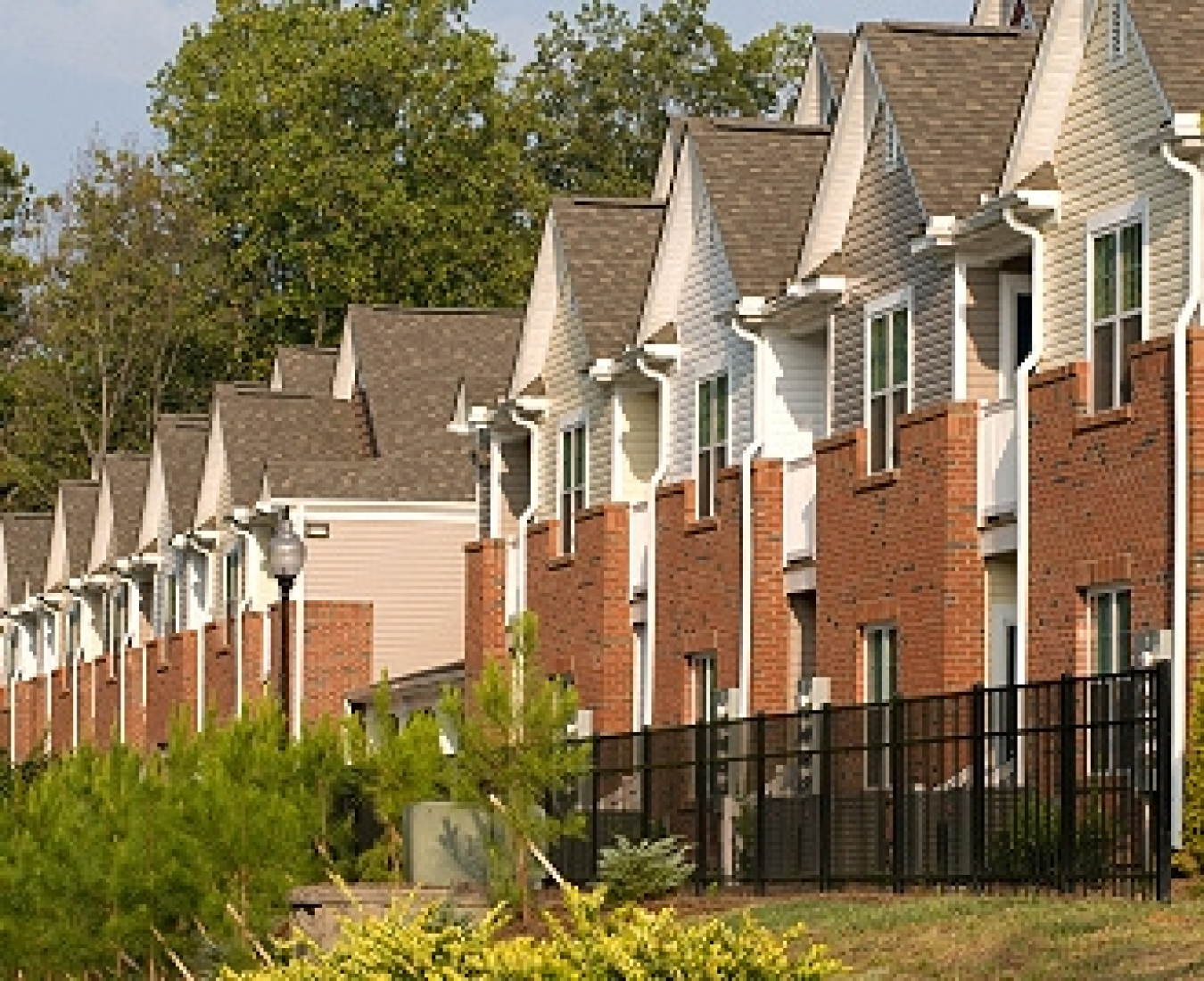 Profile photo of a row of townhomes.