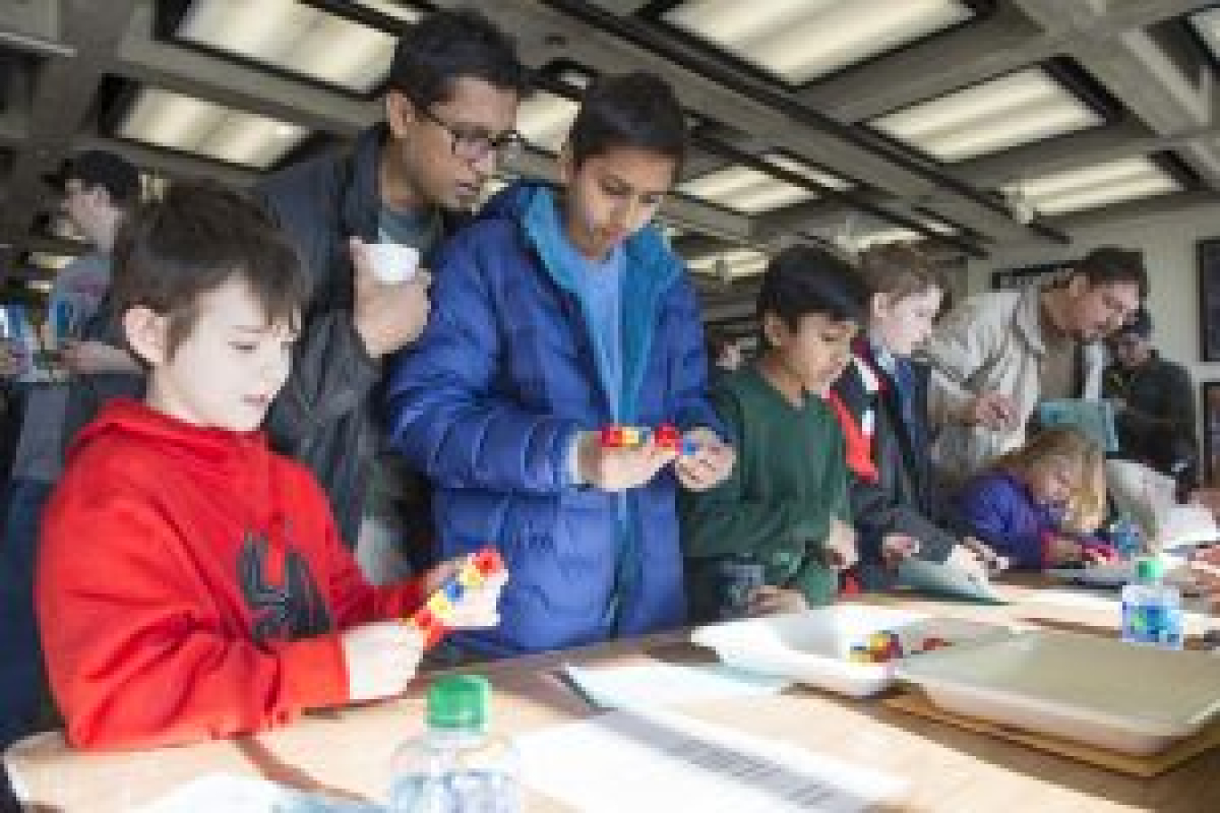 Children attempt to make as many structures as they can while following the same kinds of rules particles use to combine.