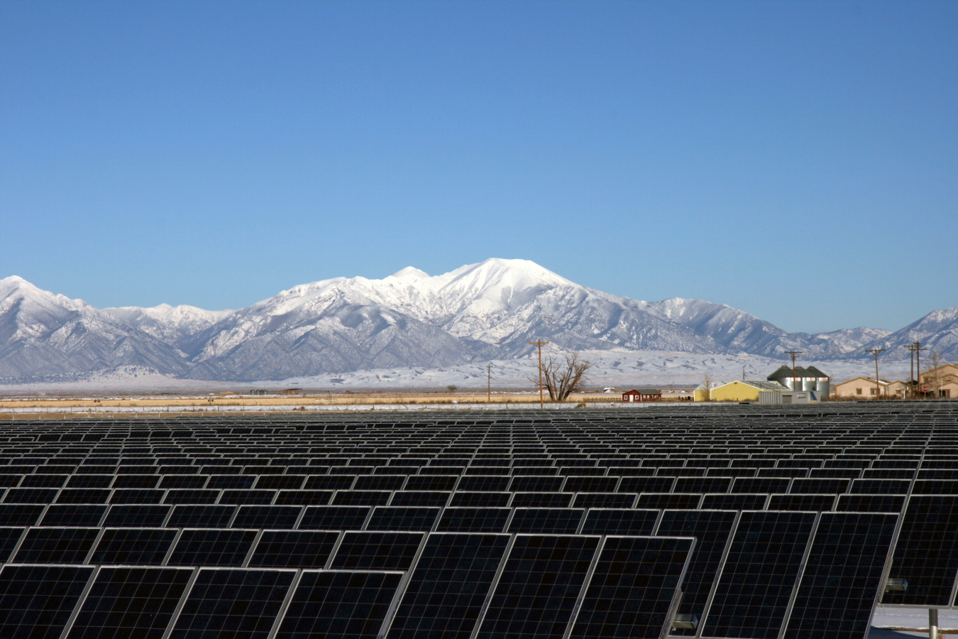 Solar panels at the National Renewable Energy Lab with mountains in the background.