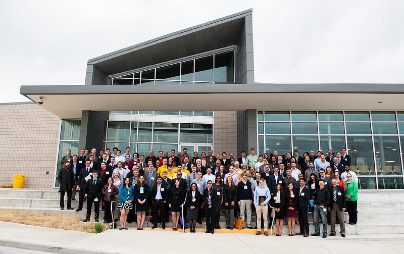 This photo shows 100 students who participated in the 2014 DOE Race to Zero Student Design Competition.
