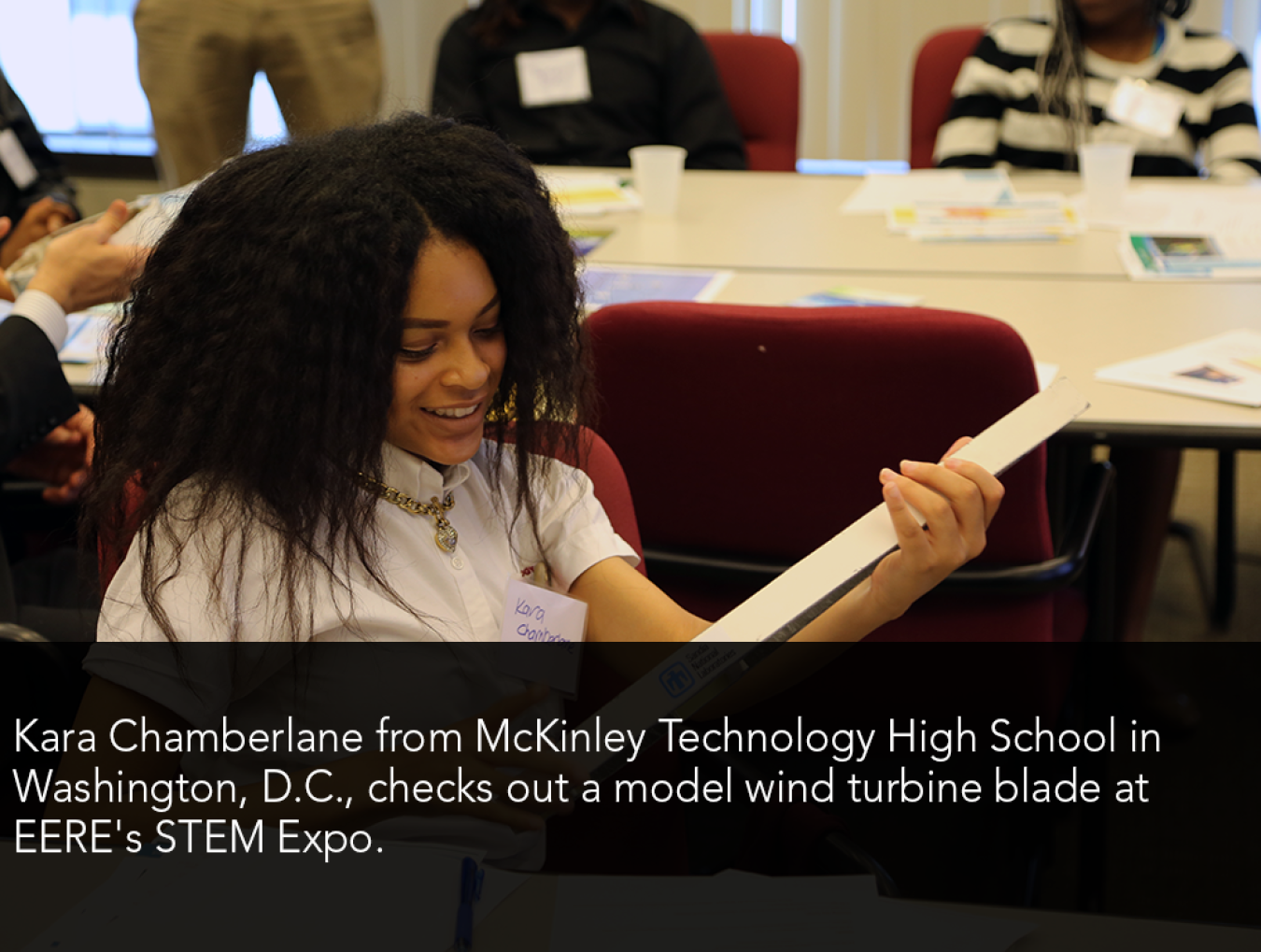 Kara Chamberlane from McKinley Technology High School in Washington, D.C., checks out a model wind turbine blade at EERE's STEM Expo.