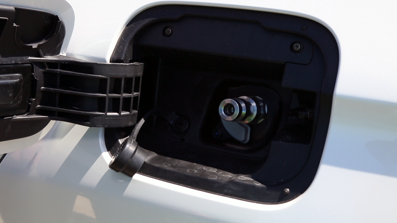 The hydrogen fuel nozzle locks on to the fuel receptacle (above) before fueling begins.