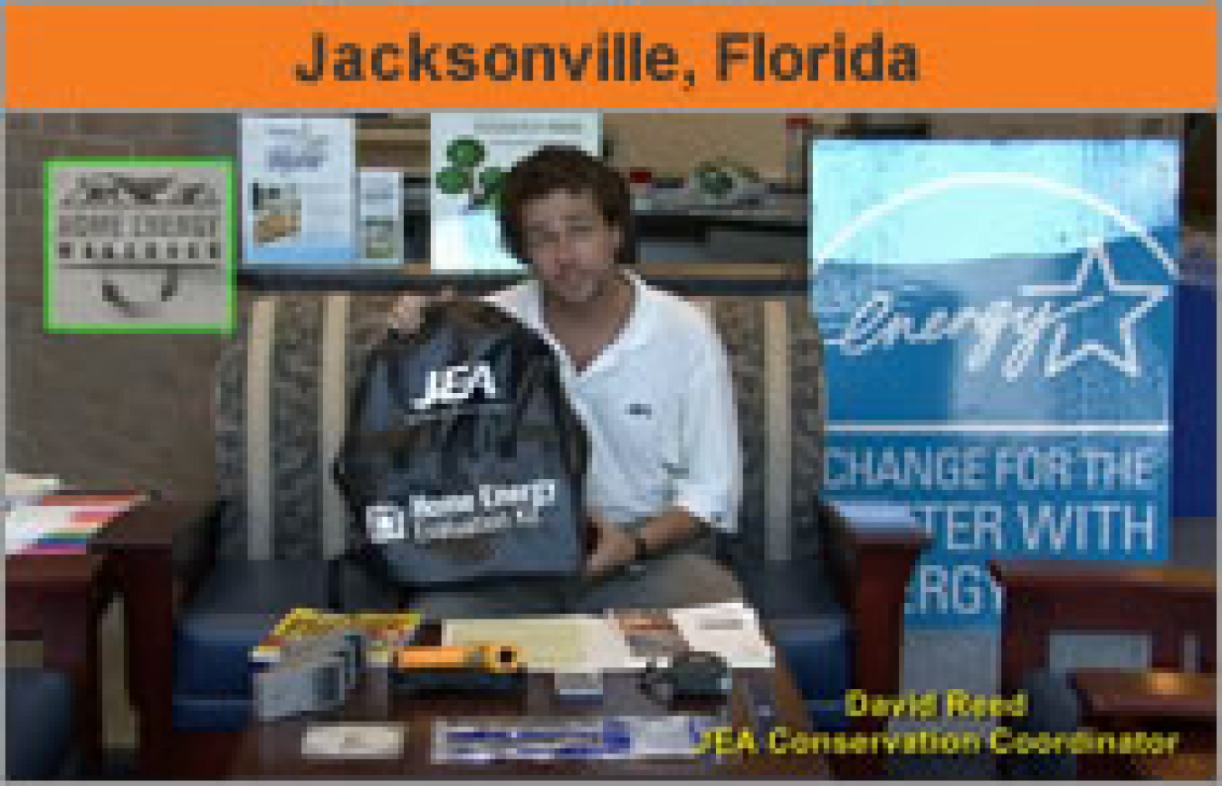 A man standing with a company booth display, and the words "Jacksonville, Florida."