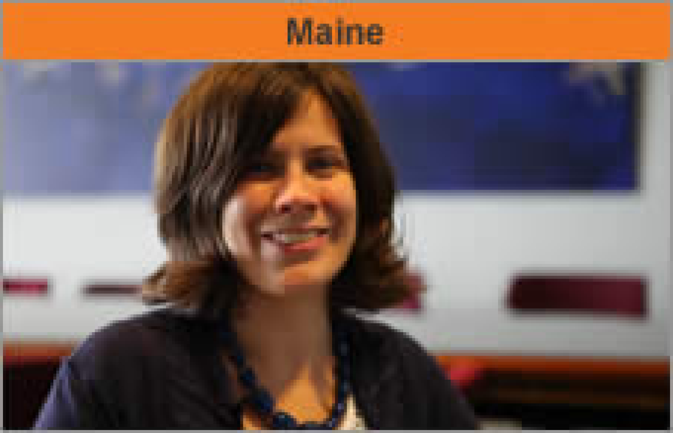 Head and shoulders of a woman facing the camera and smiling, with the word "Maine."