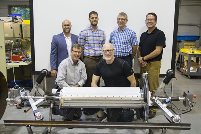 Participants in the Carnegie Mellon University (CMU) demonstration gather behind PipeDream. 