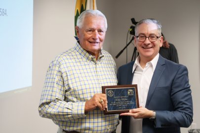 OREM Manager Jay Mullis presents service plaque to retiring member Eddie Holden