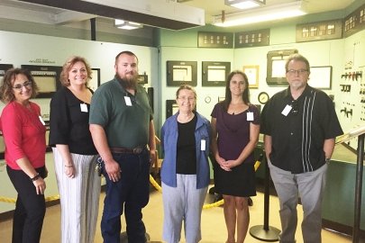 New Oak Ridge Site Specific Advisory Board members, from left, Georgette Samaras, Amy Jones, Noah Keebler, Harriett McCurdy, Andrea Browning, and Robert Whittaker visit the historic Graphite Reactor at Oak Ridge National Laboratory. 