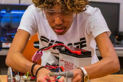 a photo of a student working on an electrical project.