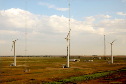 wind turbines against a blue sky.