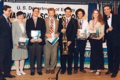 Paco Jain (fourth from the right holding the trophy) on the winning team of the 1998 National Science Bowl.